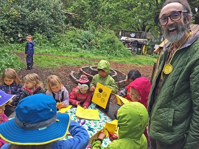 author bonding with children in the forest school